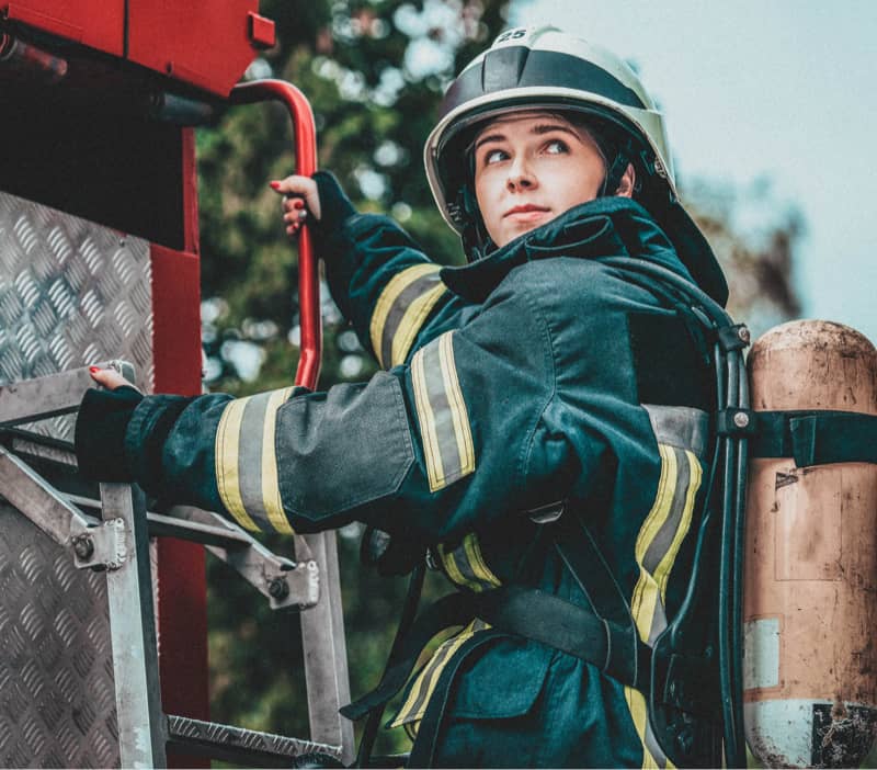 female firefighter on ladder